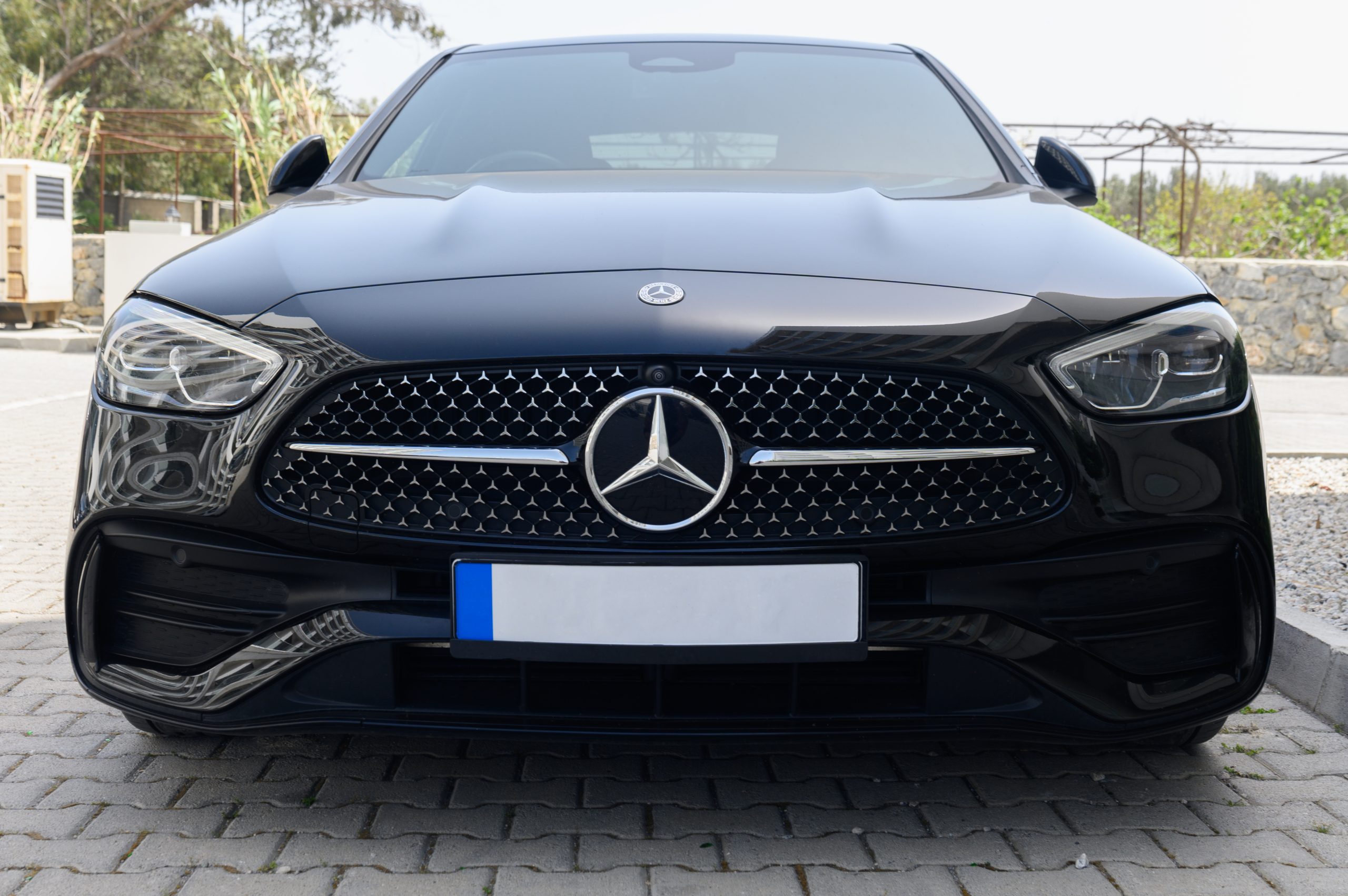 Gaziveren Cyprus 04.18.2024 - black Mercedes Benz in the parking lot near the house 6